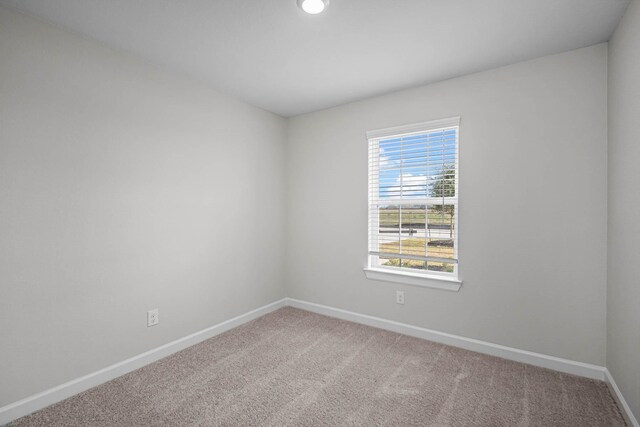 empty room with carpet flooring