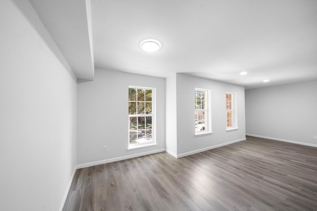 unfurnished room with hardwood / wood-style floors