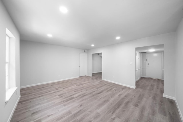 spare room with light hardwood / wood-style flooring