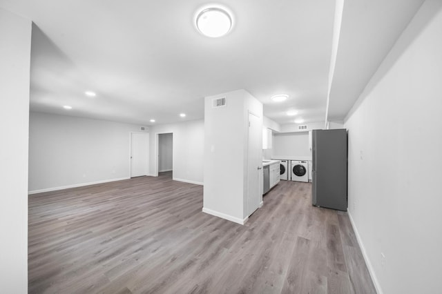 unfurnished living room featuring light wood-type flooring