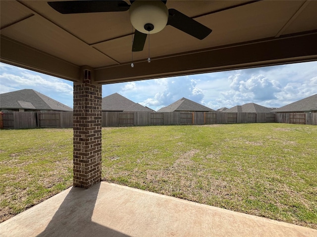 view of yard with ceiling fan and a patio area