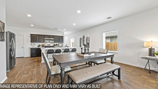 dining room with dark hardwood / wood-style flooring