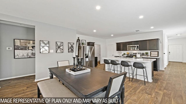 dining room with hardwood / wood-style flooring