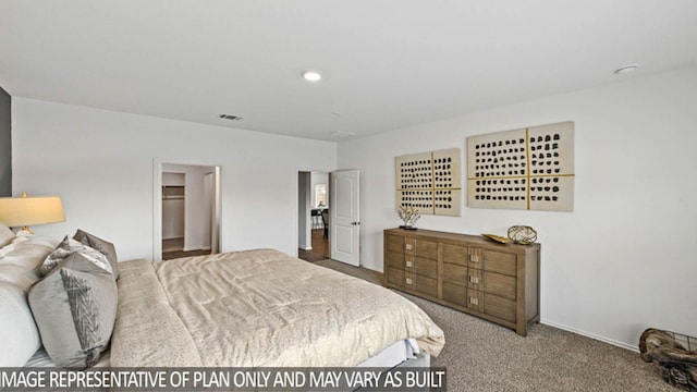 carpeted bedroom with a spacious closet and a closet