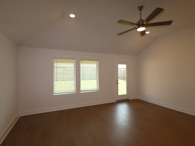 spare room featuring a ceiling fan, baseboards, dark wood-style floors, vaulted ceiling, and recessed lighting