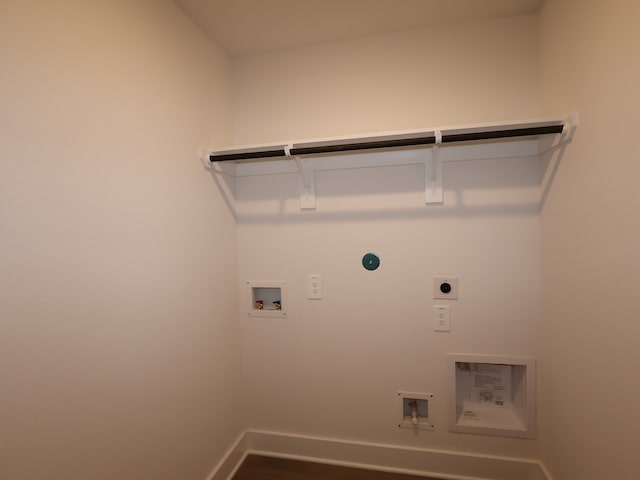 laundry area featuring laundry area, hookup for an electric dryer, dark wood finished floors, washer hookup, and baseboards