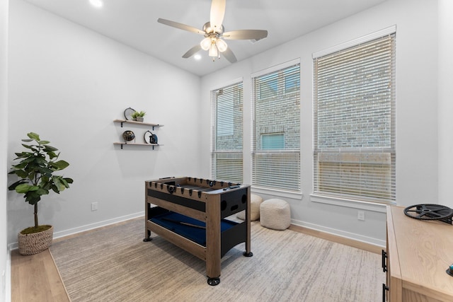 interior space featuring light wood-type flooring and ceiling fan