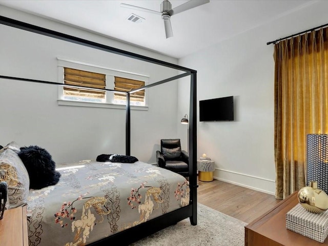 bedroom featuring ceiling fan and hardwood / wood-style floors