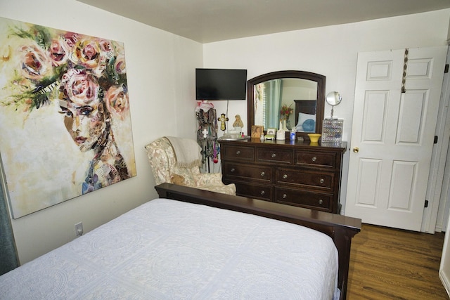 bedroom featuring dark wood-type flooring