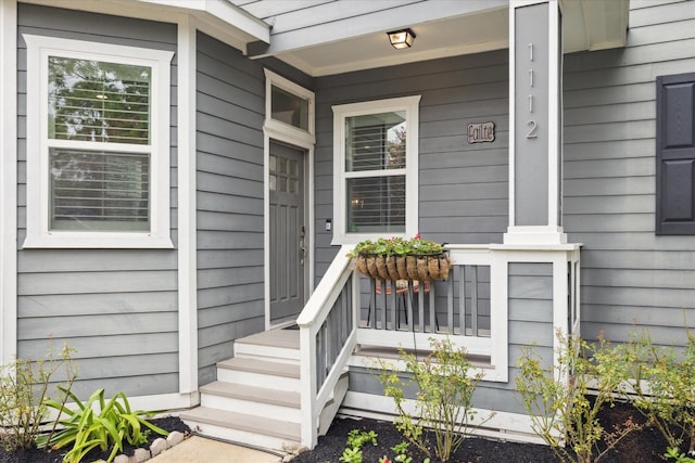 entrance to property featuring covered porch