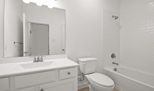 full bathroom with vanity, toilet, and tiled shower / bath combo