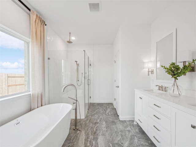 bathroom with vanity and plus walk in shower