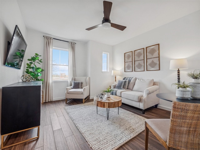 living room with dark hardwood / wood-style floors and ceiling fan