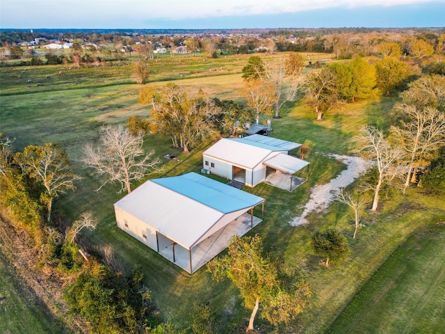 birds eye view of property featuring a rural view