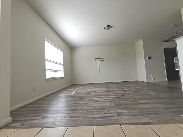 unfurnished room featuring hardwood / wood-style flooring