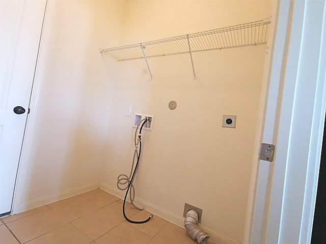 laundry area with hookup for an electric dryer, light tile patterned floors, and hookup for a washing machine