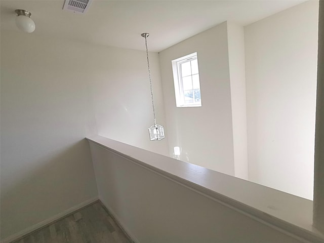 corridor with dark hardwood / wood-style floors