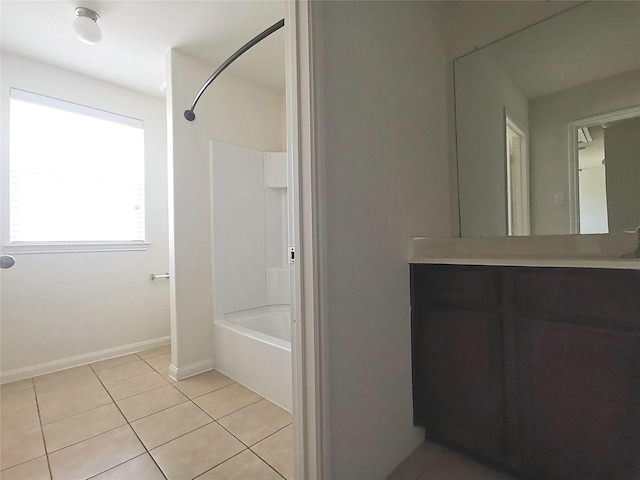 bathroom featuring tile patterned floors, vanity, and bathing tub / shower combination