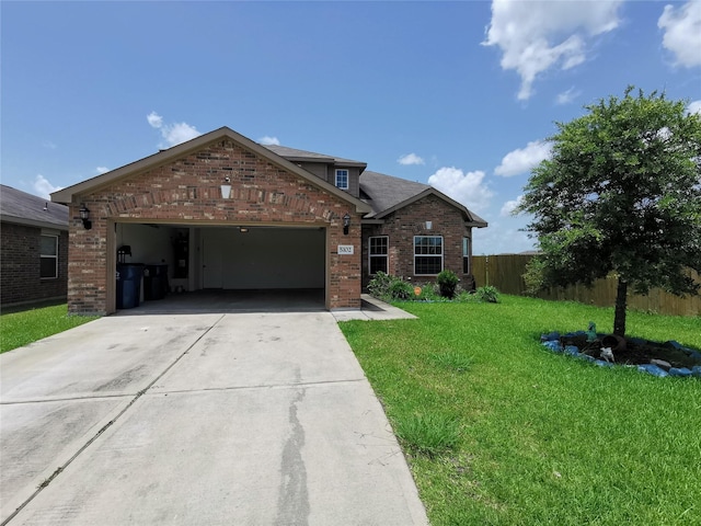 view of front facade featuring a front yard and a garage