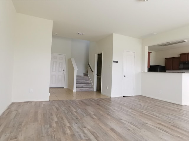 unfurnished living room with light hardwood / wood-style floors