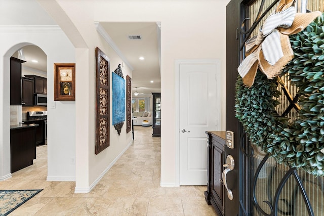 hall featuring ornamental molding