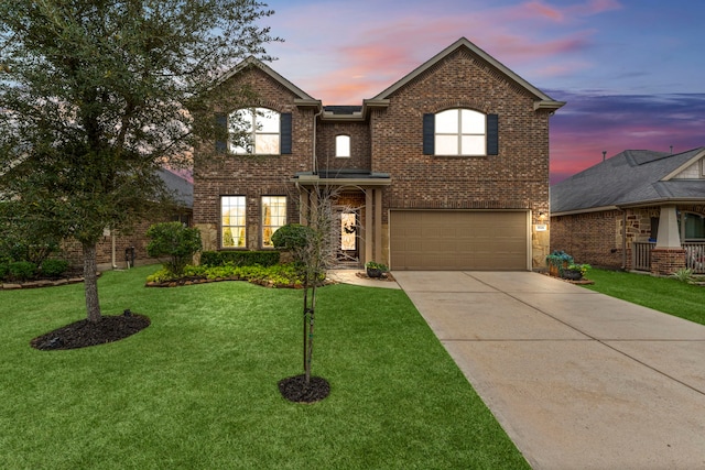 view of front facade with a lawn and a garage