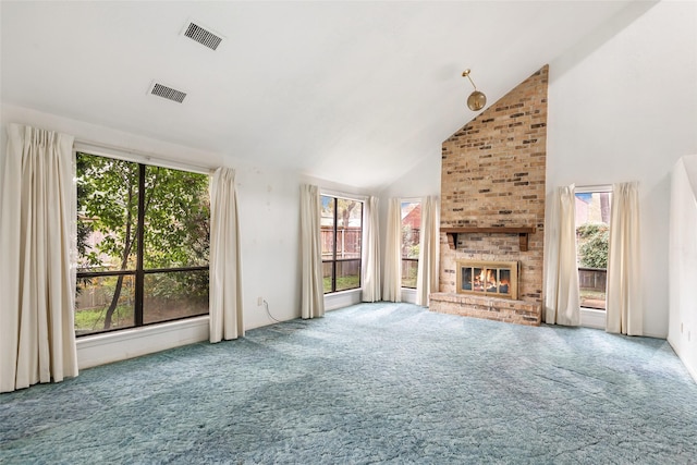 unfurnished living room featuring carpet, high vaulted ceiling, and a fireplace