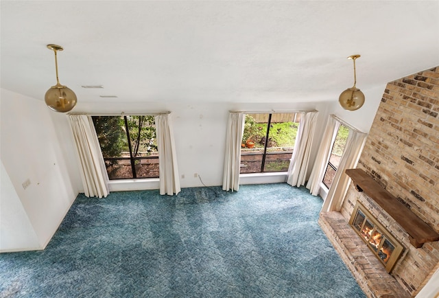 living room featuring a fireplace and dark colored carpet