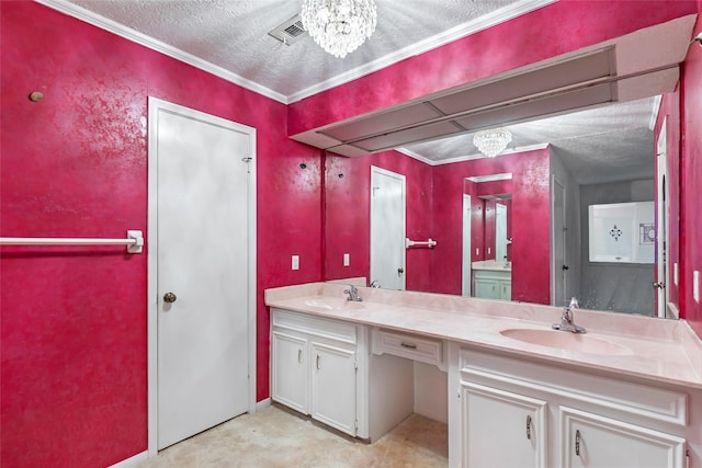 bathroom with vanity, a textured ceiling, an inviting chandelier, and ornamental molding