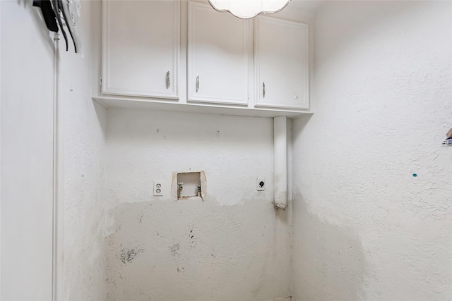 laundry room featuring cabinets, hookup for a washing machine, and electric dryer hookup