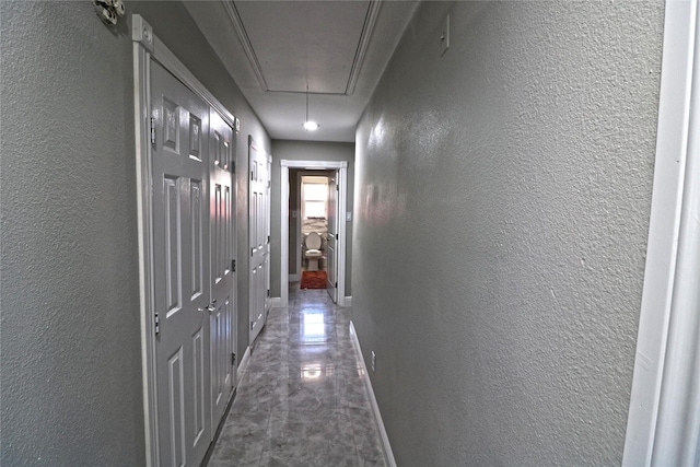 corridor with dark tile patterned floors