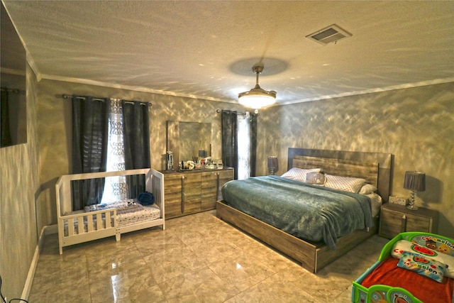 bedroom featuring crown molding and a textured ceiling