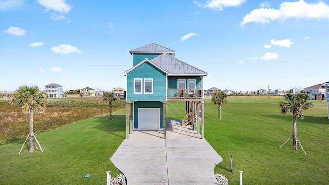 exterior space with a carport, a front yard, and a garage