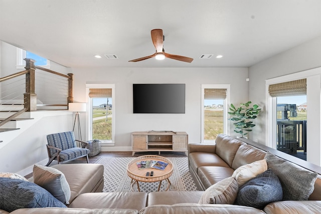 4003 Mitote Dr, Galveston, TX 77554 - living room with healthy amount of natural light, stairs, ceiling fan, recessed lighting, and wood finished floors