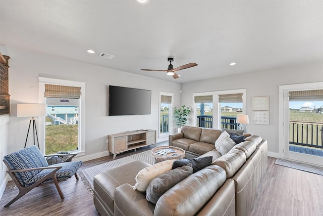 4003 Mitote Dr, Galveston, TX 77554 - living room featuring baseboards, wood finished floors, ceiling fan, and recessed lighting