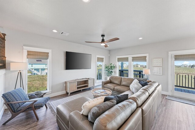 4003 Mitote Dr, Galveston, TX 77554 - living room featuring baseboards, wood finished floors, a ceiling fan, and recessed lighting