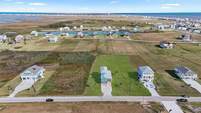 bird's eye view with a water view and a rural view