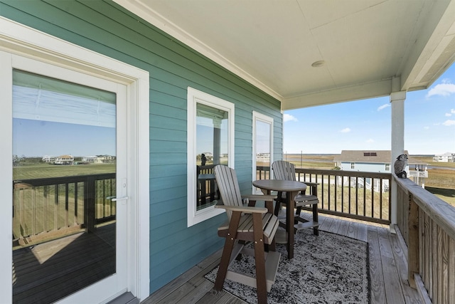 4003 Mitote Dr, Galveston, TX 77554 - view of wooden balcony with a wooden deck