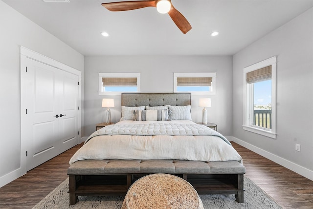 bedroom with ceiling fan, dark hardwood / wood-style floors, and a closet