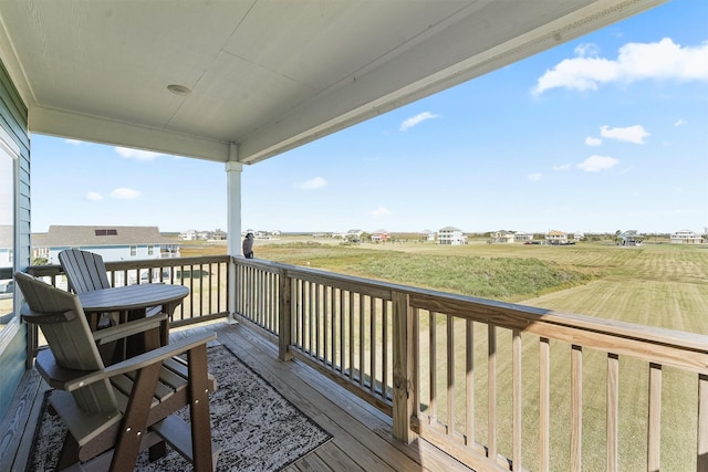 wooden terrace featuring a rural view