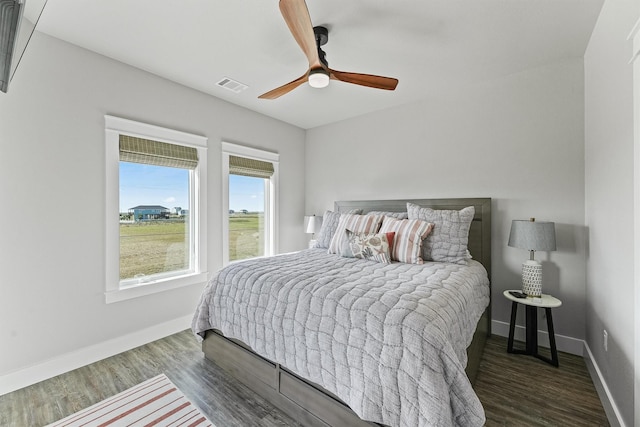 bedroom featuring dark hardwood / wood-style floors and ceiling fan