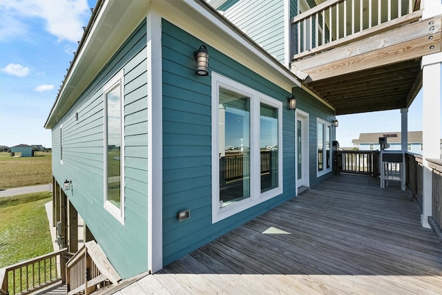 view of property exterior with a wooden deck