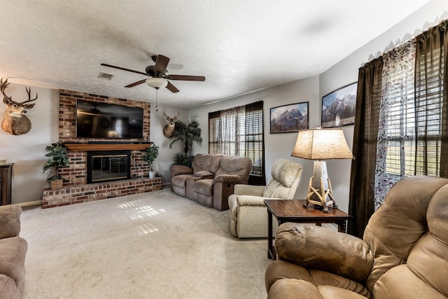 living room with carpet floors, a brick fireplace, and a wealth of natural light