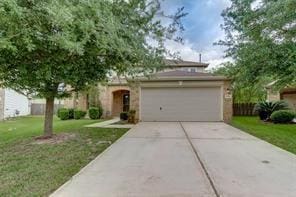 view of front facade featuring a garage and a front lawn