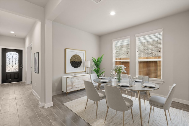 dining room with dark hardwood / wood-style flooring