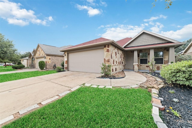 view of front facade with a front yard and a garage