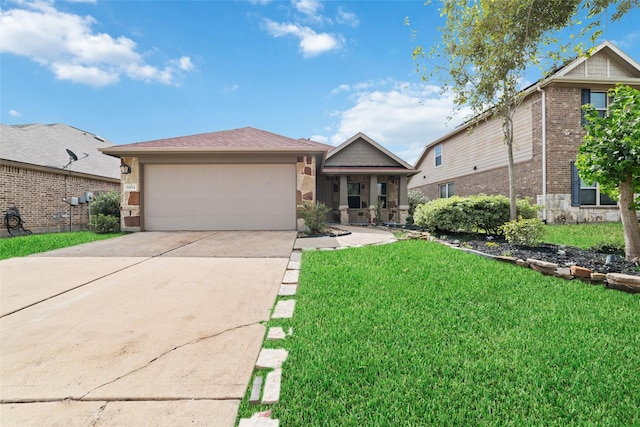 view of front of home featuring a front yard and a garage