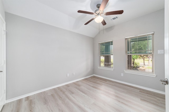 spare room featuring ceiling fan, light hardwood / wood-style flooring, and lofted ceiling