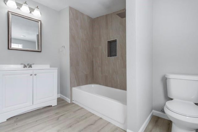 full bathroom featuring toilet, vanity, shower / bath combination, and hardwood / wood-style flooring