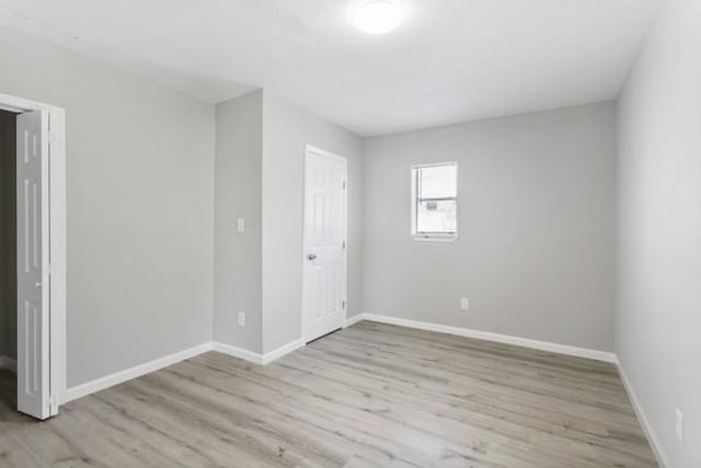 unfurnished room featuring light hardwood / wood-style floors